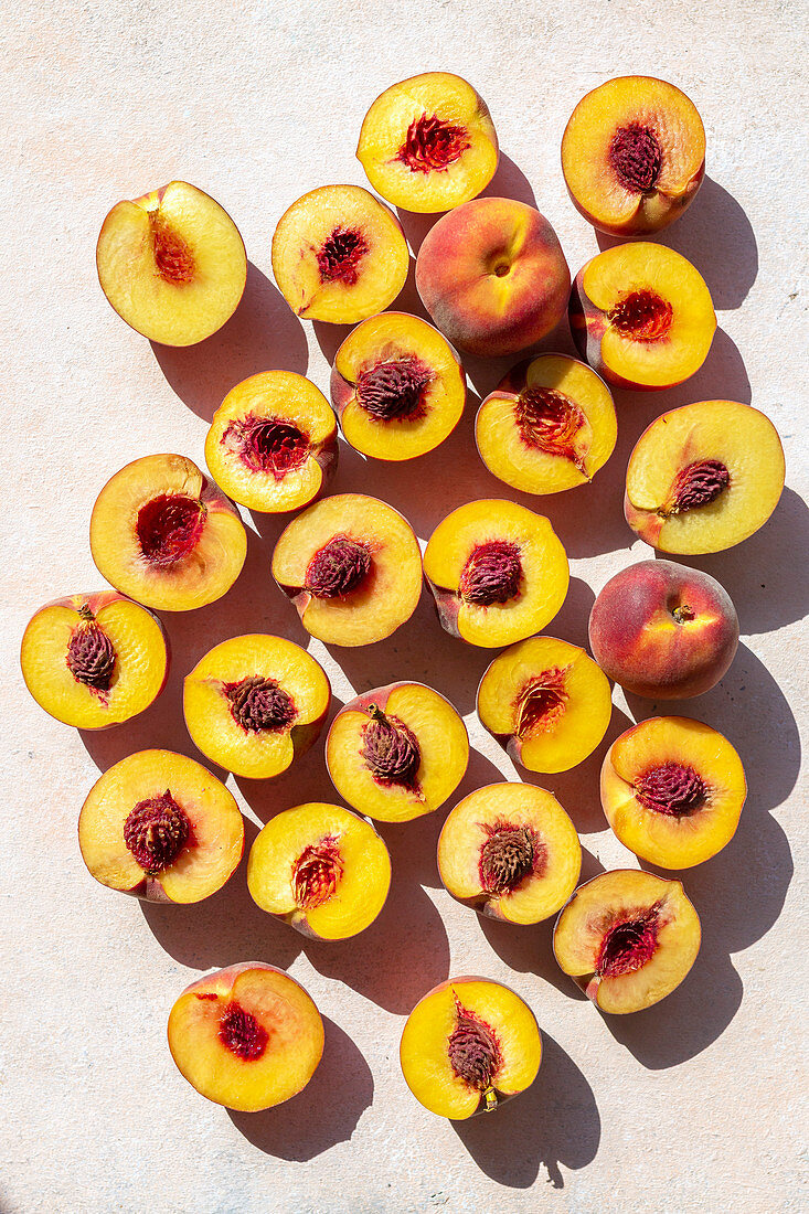 Sliced peaches on the table, top view