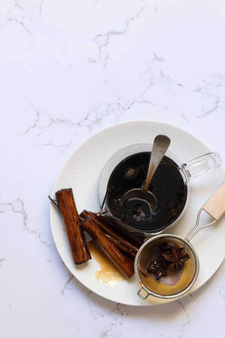 Spiced chai syrup with cinnamon sticks and star of anise.