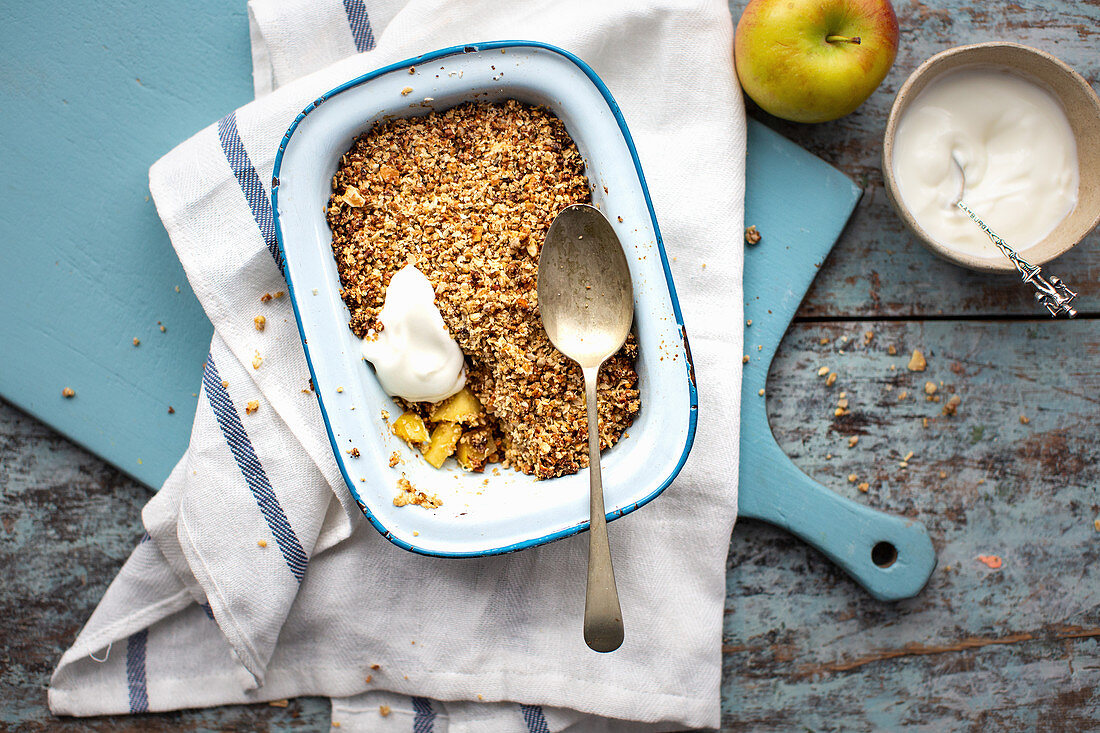 Apple crumble in an enamel tin