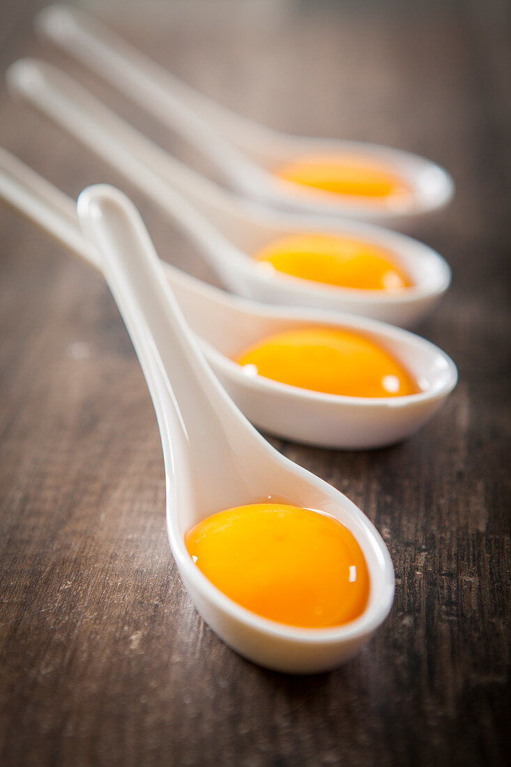 An egg yolk on a spoon