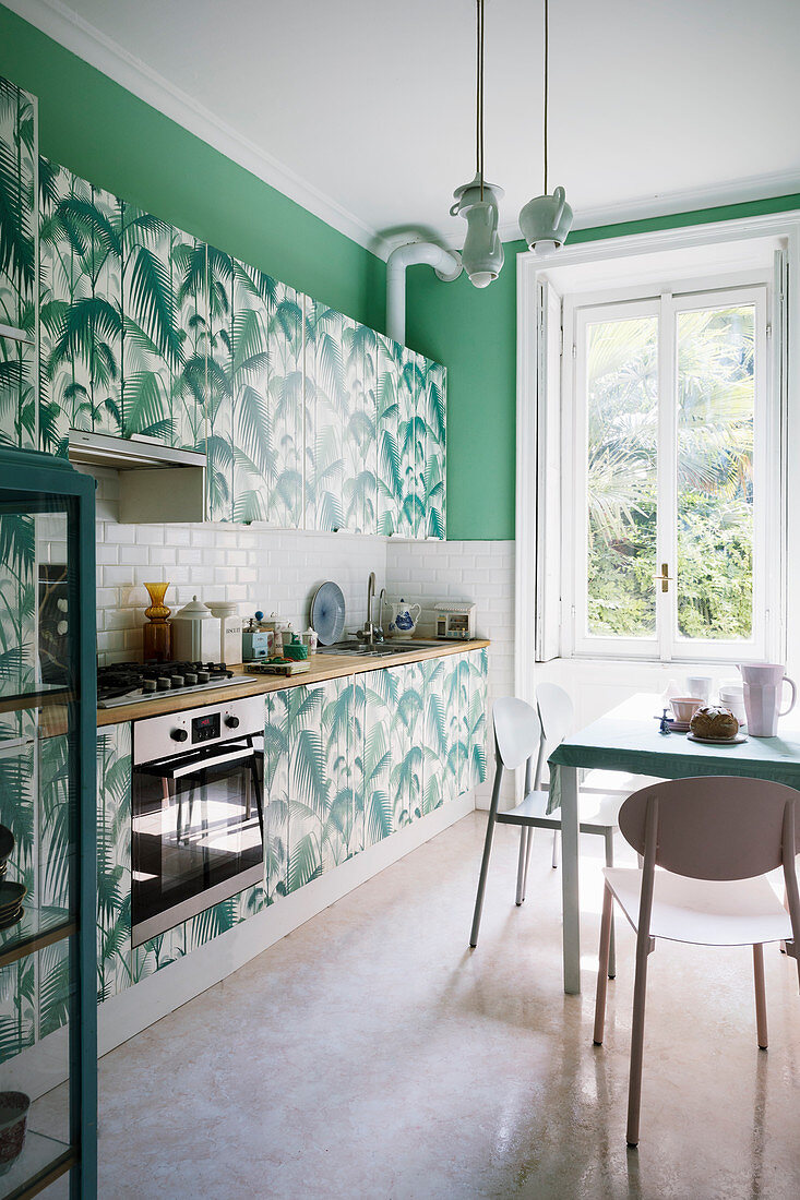 Kitchen revamped with jungle motif and green walls