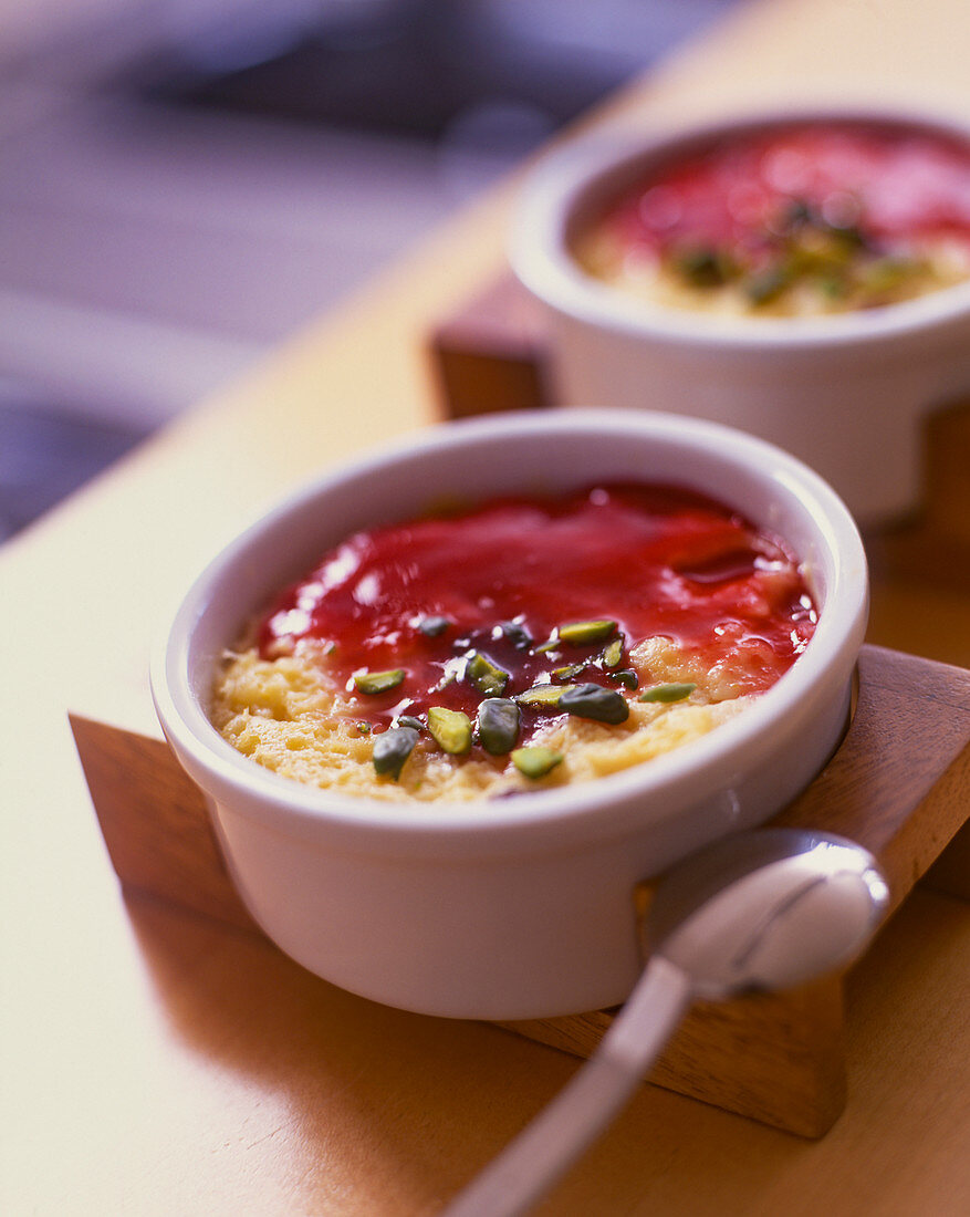 Flan with pistachios and berry coulis