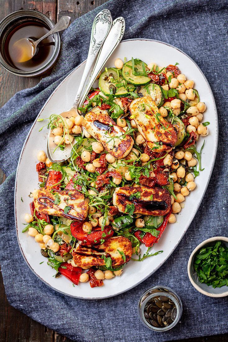 Chickpea, baked pepper, arugula and halloumi salad