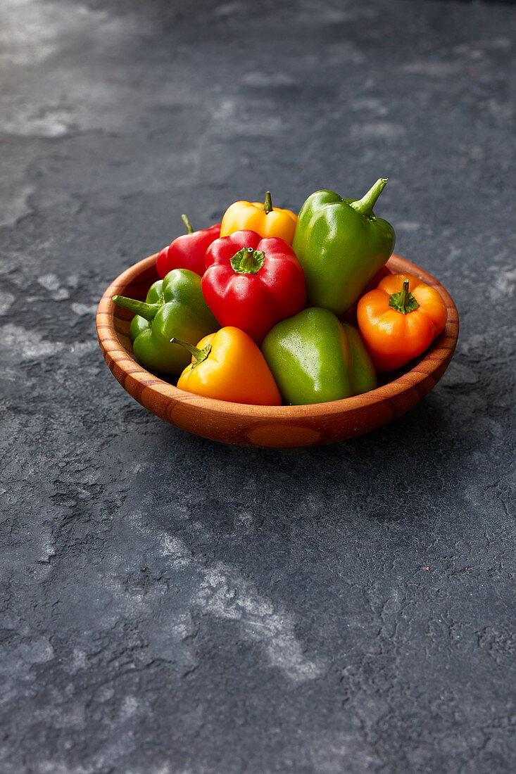 Mini peppers in a wooden bowl