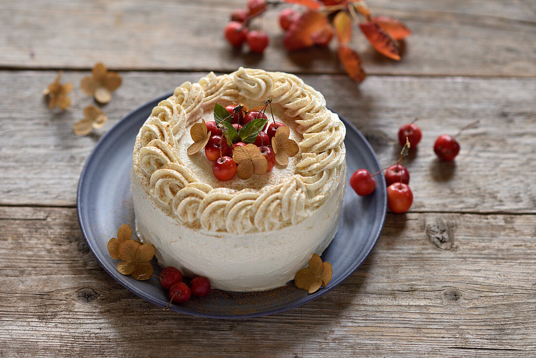 Vegan apple and almond cream cake with date caramel and mini apples