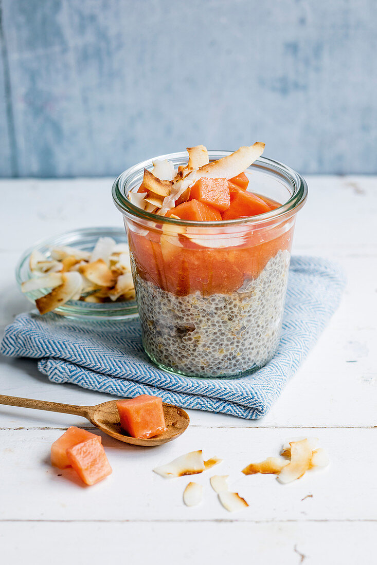 Chia coconut pudding with papaya and coconut chips