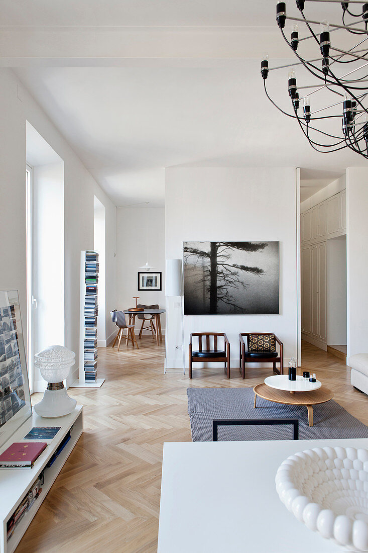 Modern open-plan interior with herringbone parquet floor