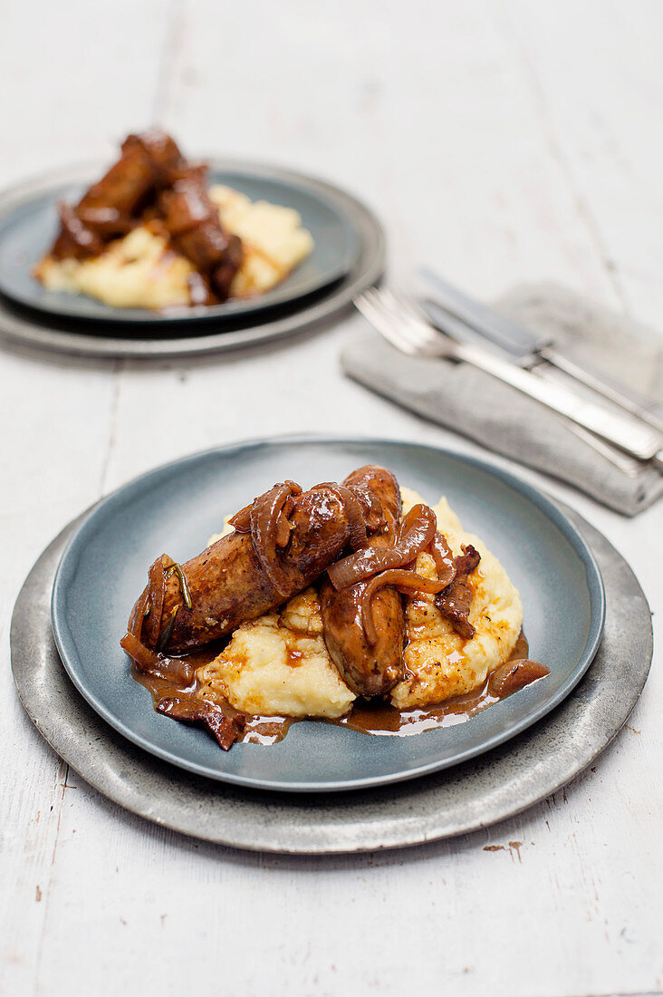Braised Italian sausages with cheesy polenta
