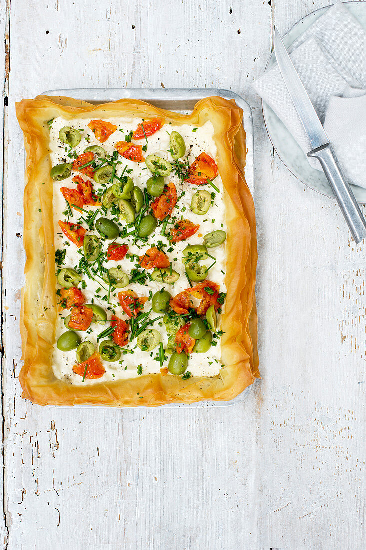 Simple goat's curd, olive and tomato tart