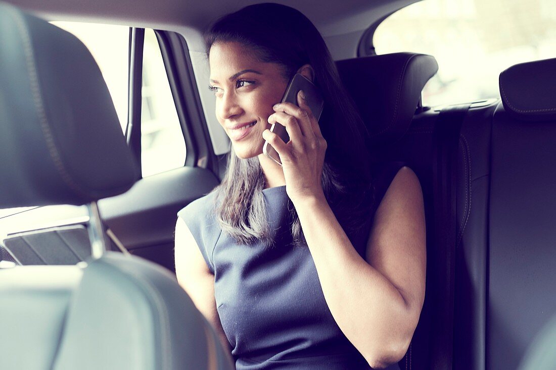 Business woman sitting in car