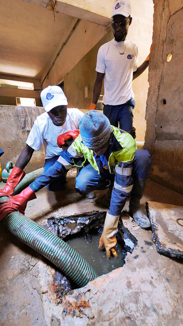 Draining a sewage pit in Senegal