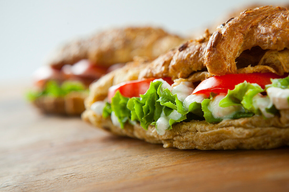 croissant stuffed with turkey, cheese, tomatoe and lettuce