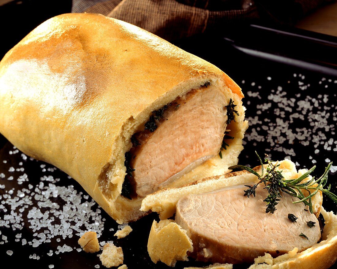 Smoked pork rib (Kassler) with herbs in bread dough