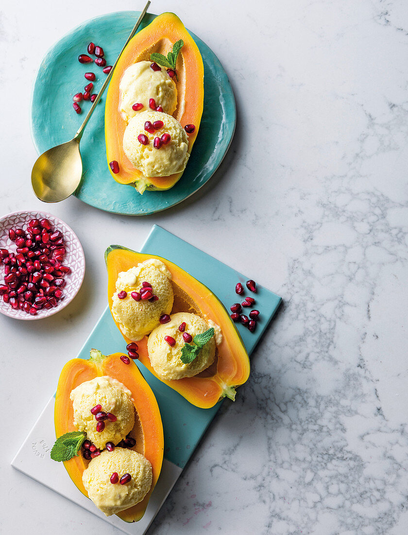 Mango and ice cream with pomegranate rubies