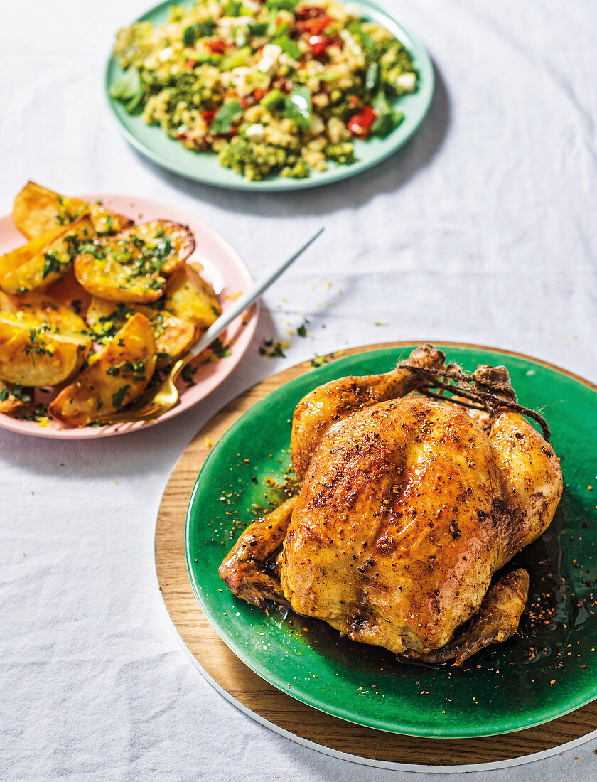 Moroccan roast chicken with grain salad and roasted potatoes