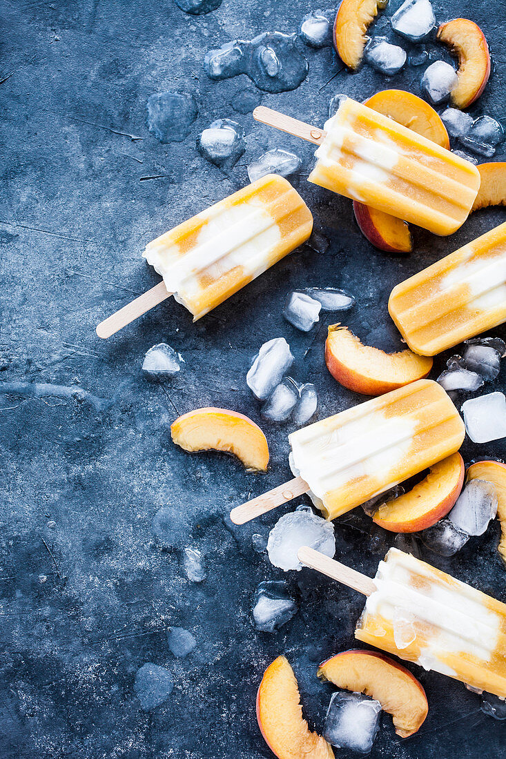Popsicles made from peaches, orange juice and greek yogurt