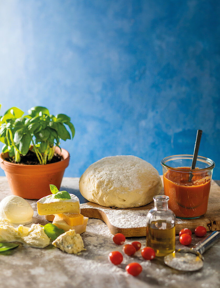 Pizza dough, roasted tomato sauce and pizza ingredients