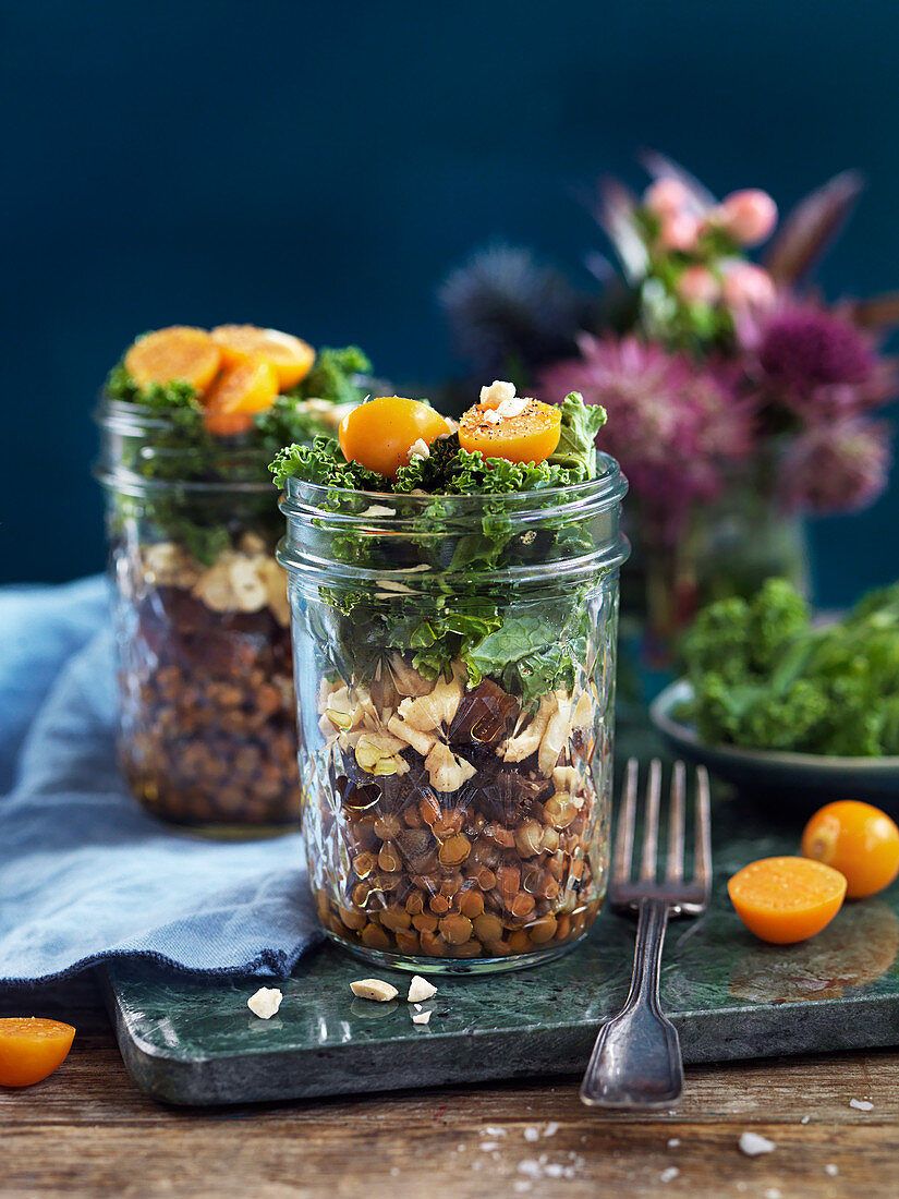 Lentil salad with nuts, kale, dried dates and physalis