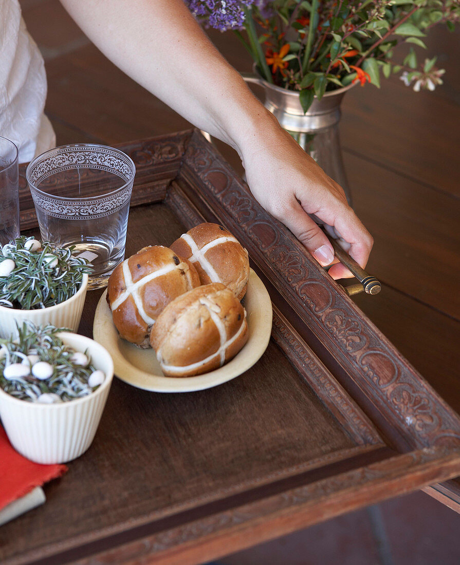 Hot cross buns and Easter decorations on DIY tray made from old wooden frame