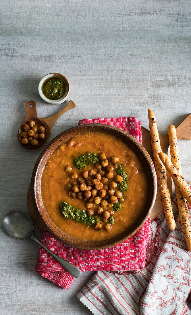 Spicy chickpea soup with coriander pesto and dukkah breadstick