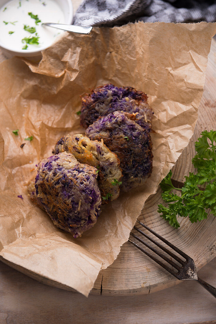 Vegan red cabbage and potato fritters with a herb dip
