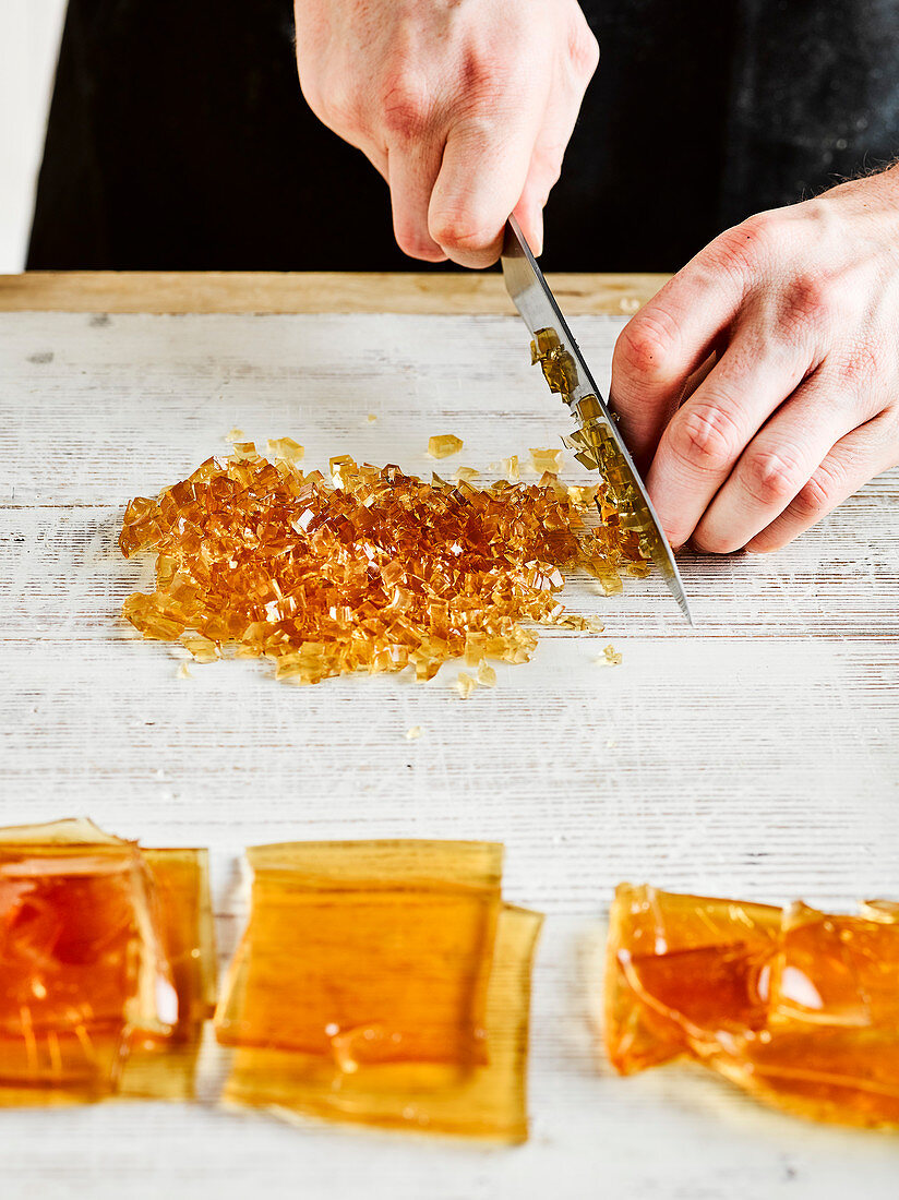 Cutting stock jelly into thin strips and chop finely