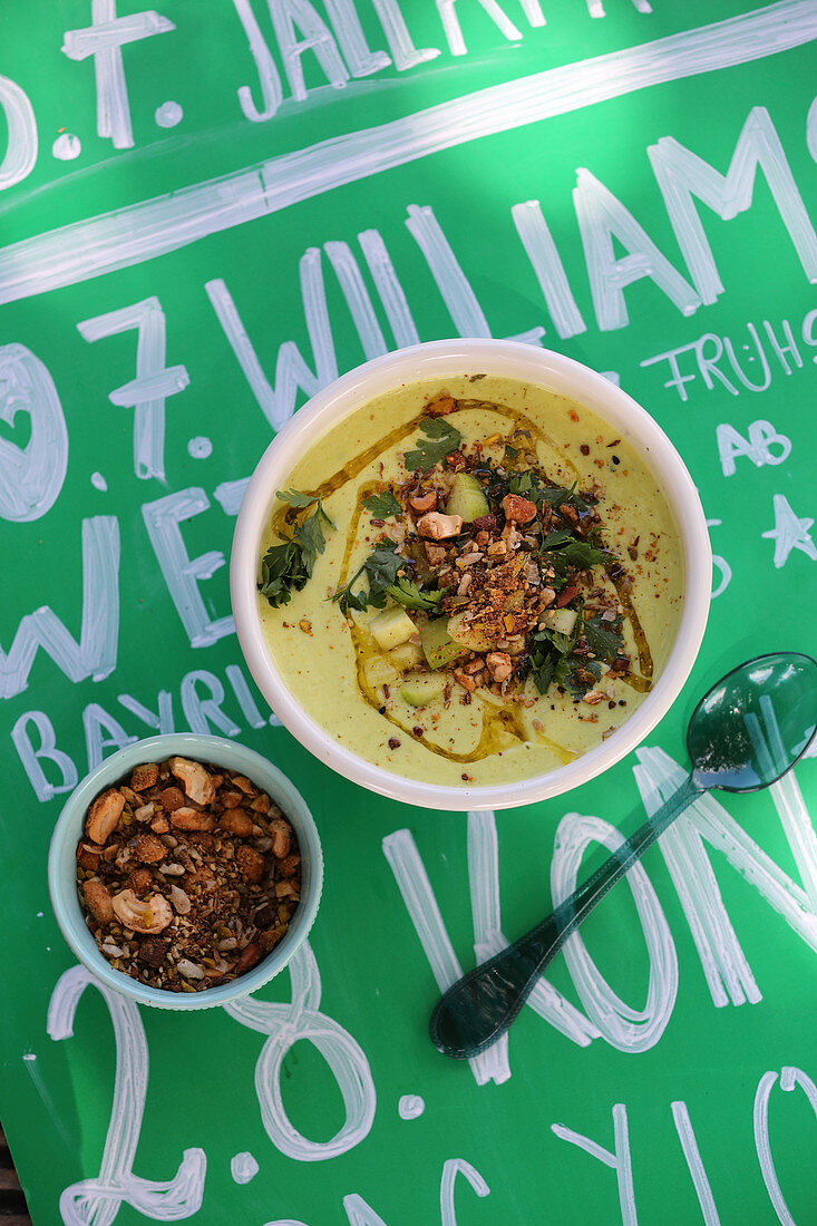 Cold avocado soup with dukkah nut topping