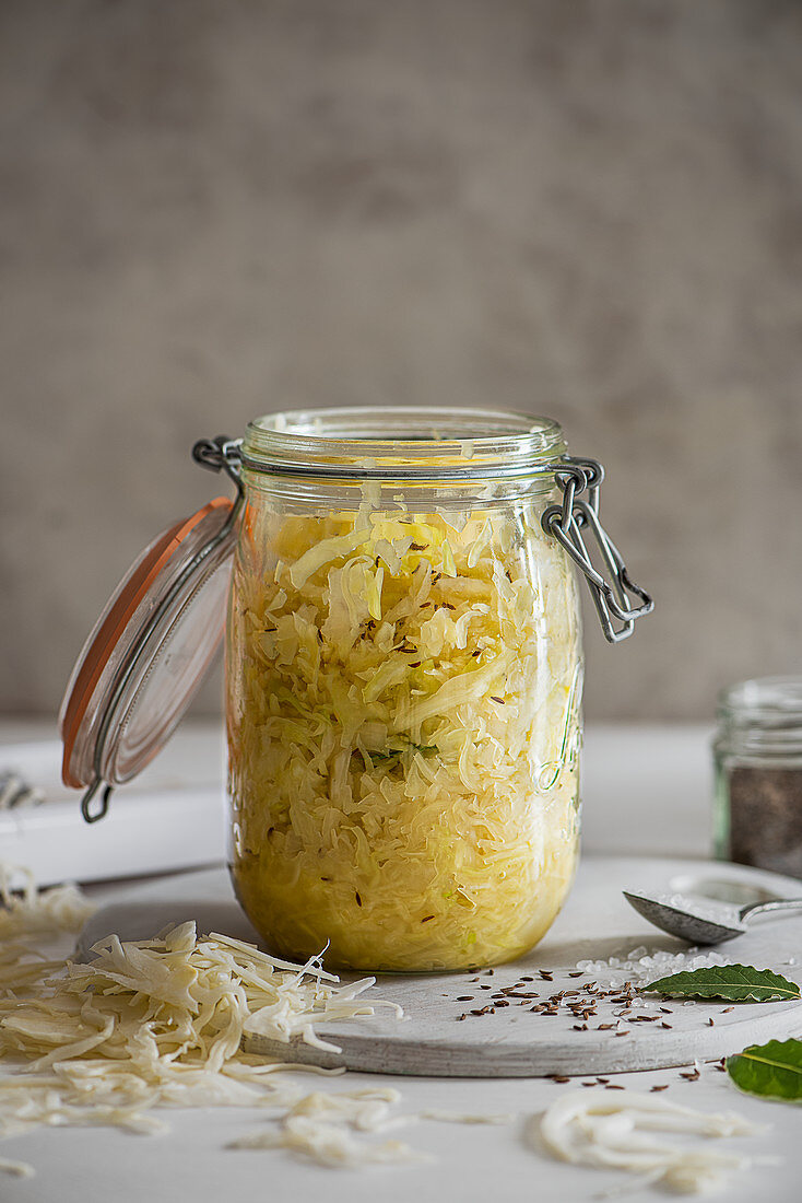 Homemade sauerkraut with seasalt , bay leaves and caraway seeds