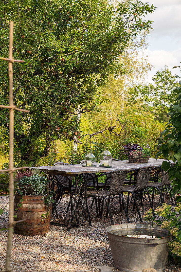 Rustic garden table handmade from boards and old sewing machine bases