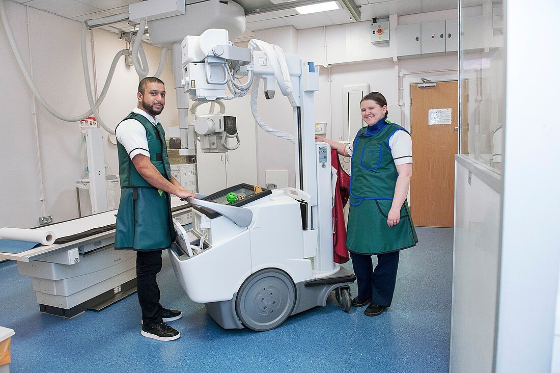 Radiographers with a mobile X-ray machine