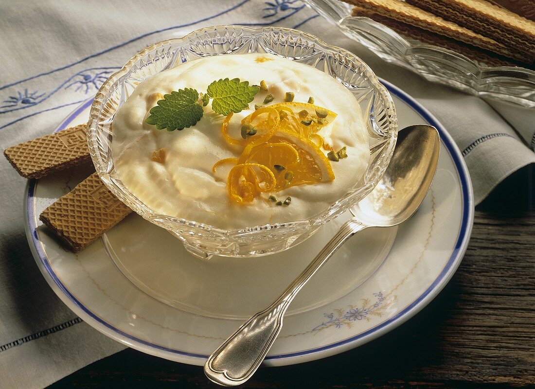 Orange yoghurt mousse in small bowl