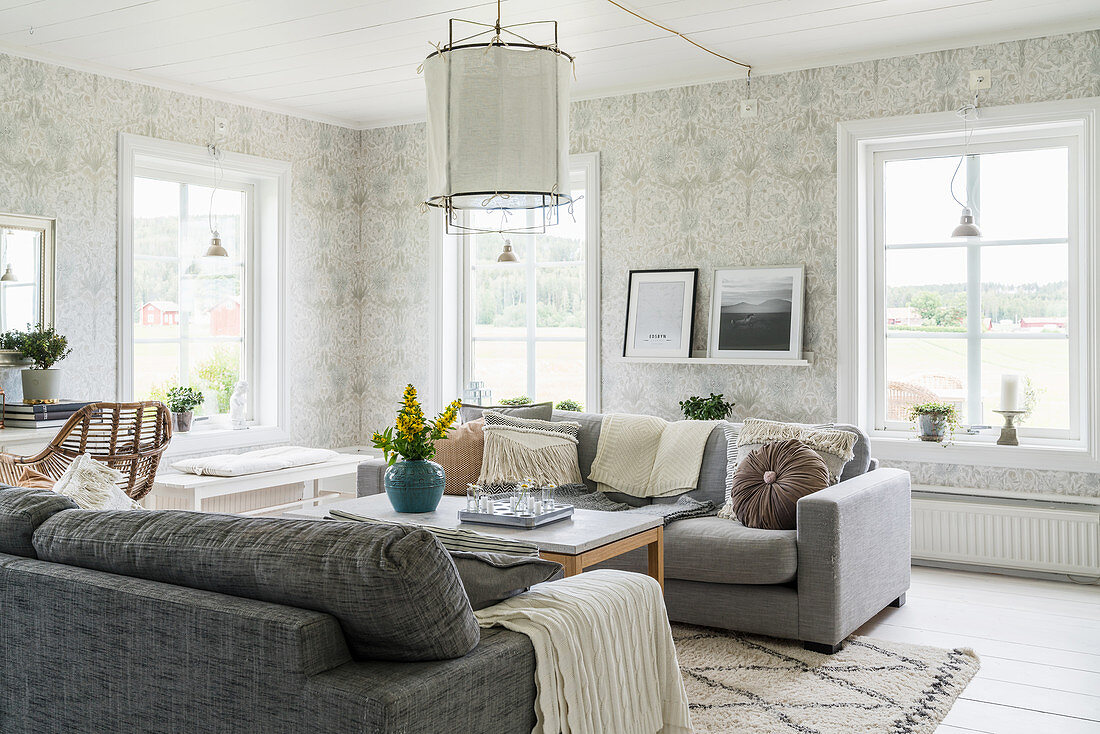 Ornate wallpaper in classic living room in shades of grey