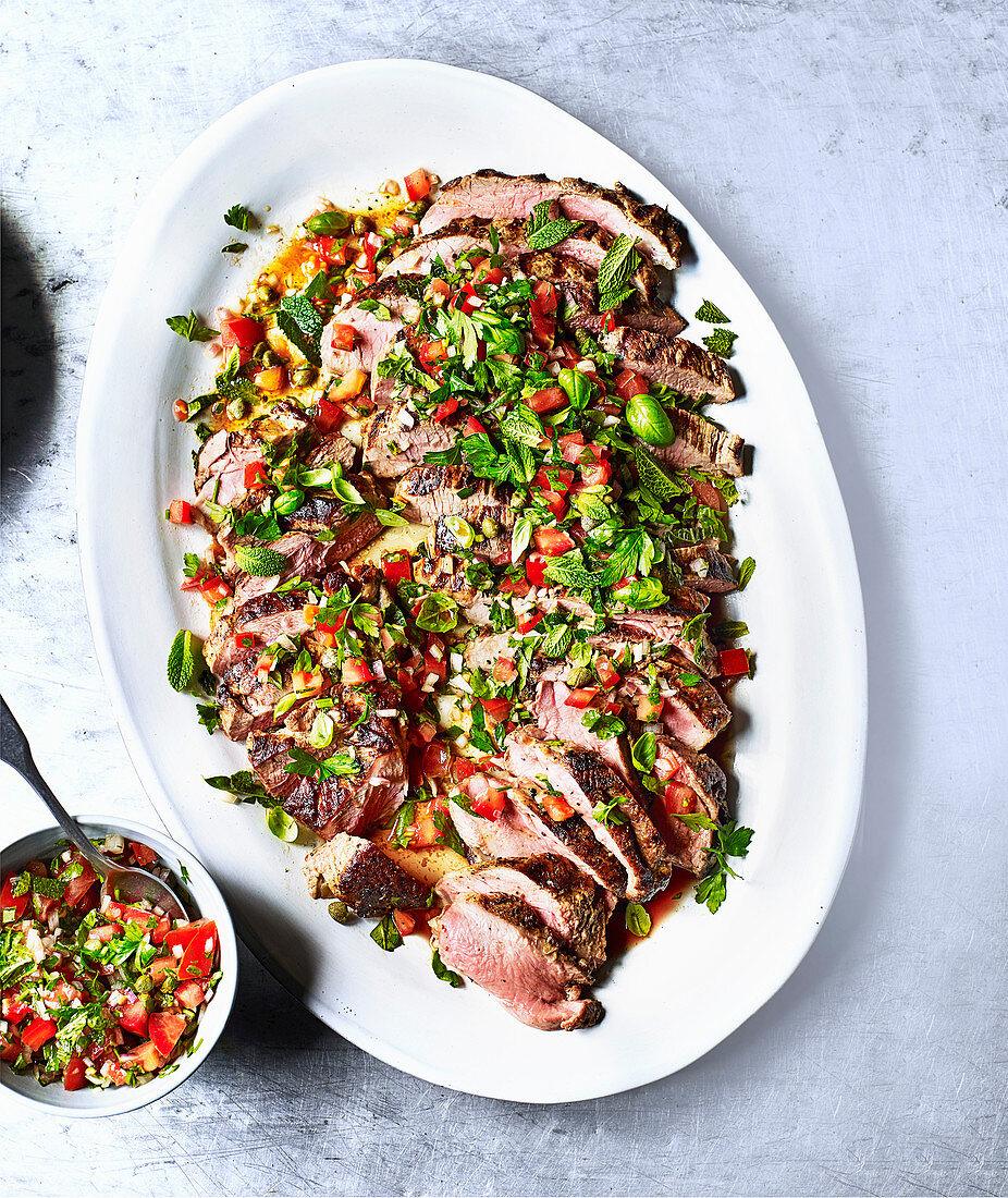 Roast lamb with tomato and caper marinade