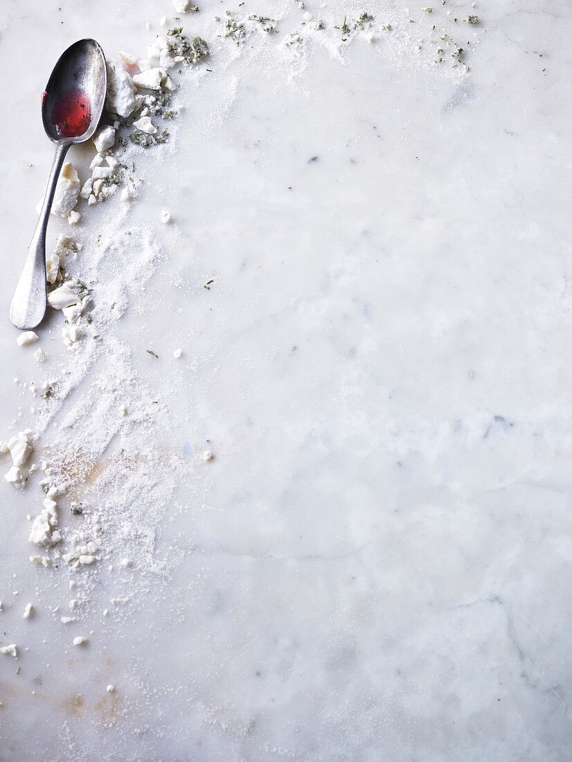 A spoon of jam on a marble background