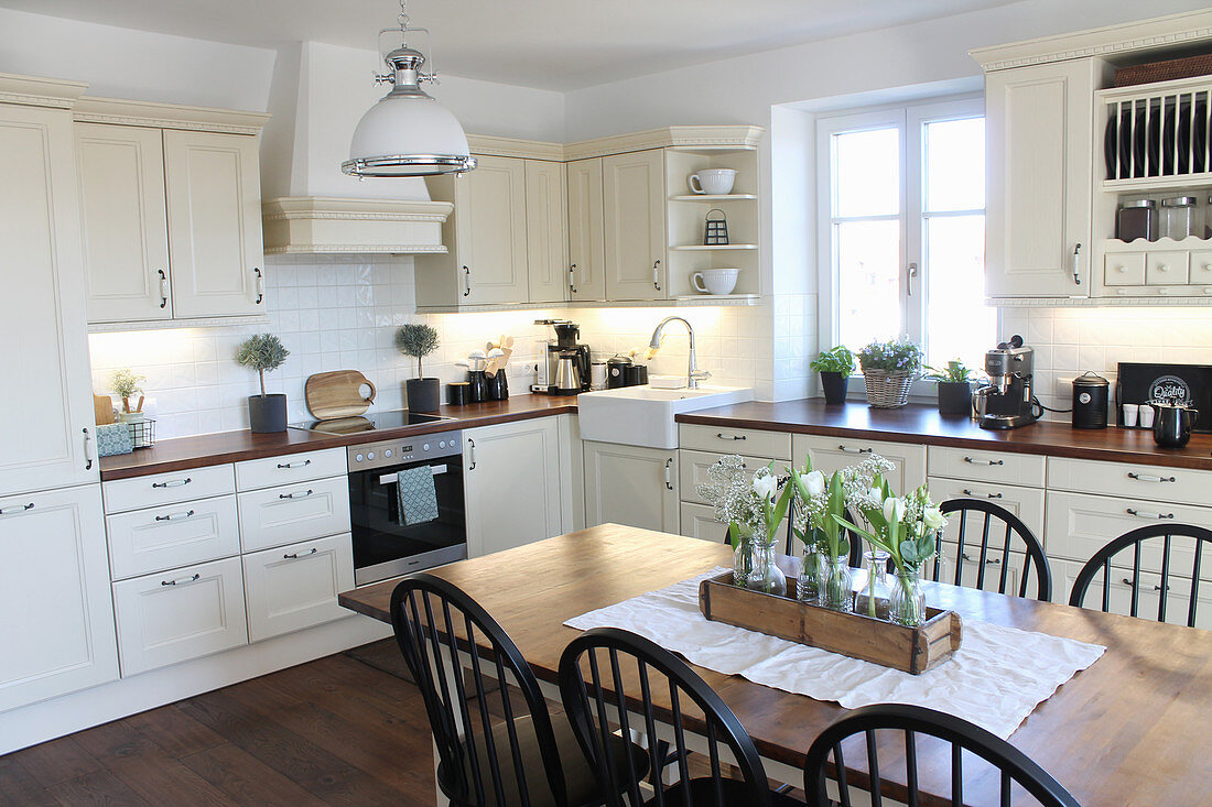 Dining table in Scandinavian-style country-house kitchen