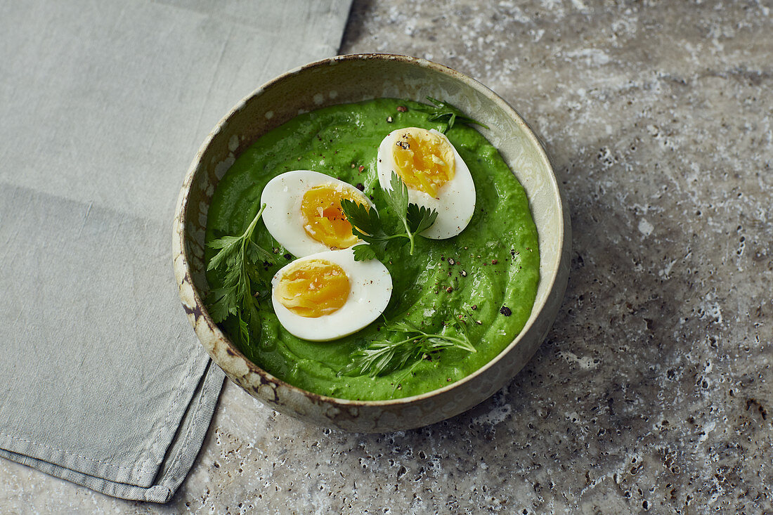Boiled eggs with green purée