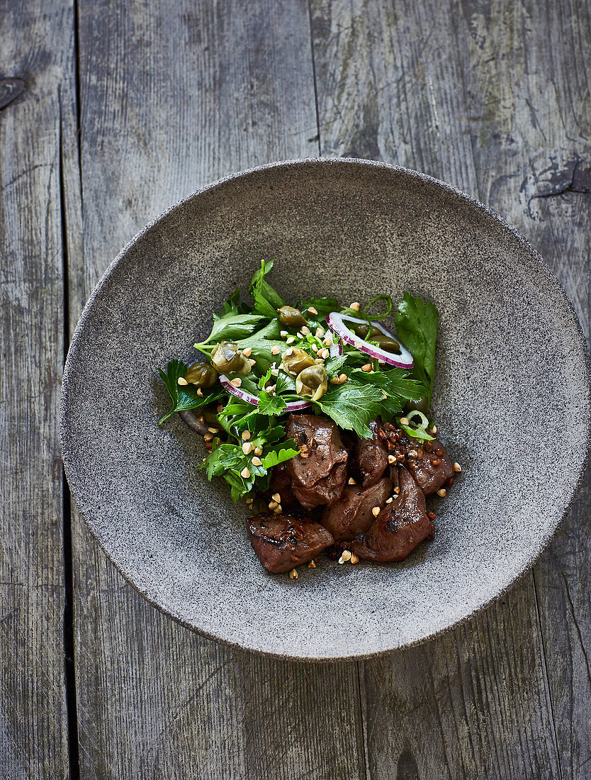 Fried ox heart with a parsley and caper salad