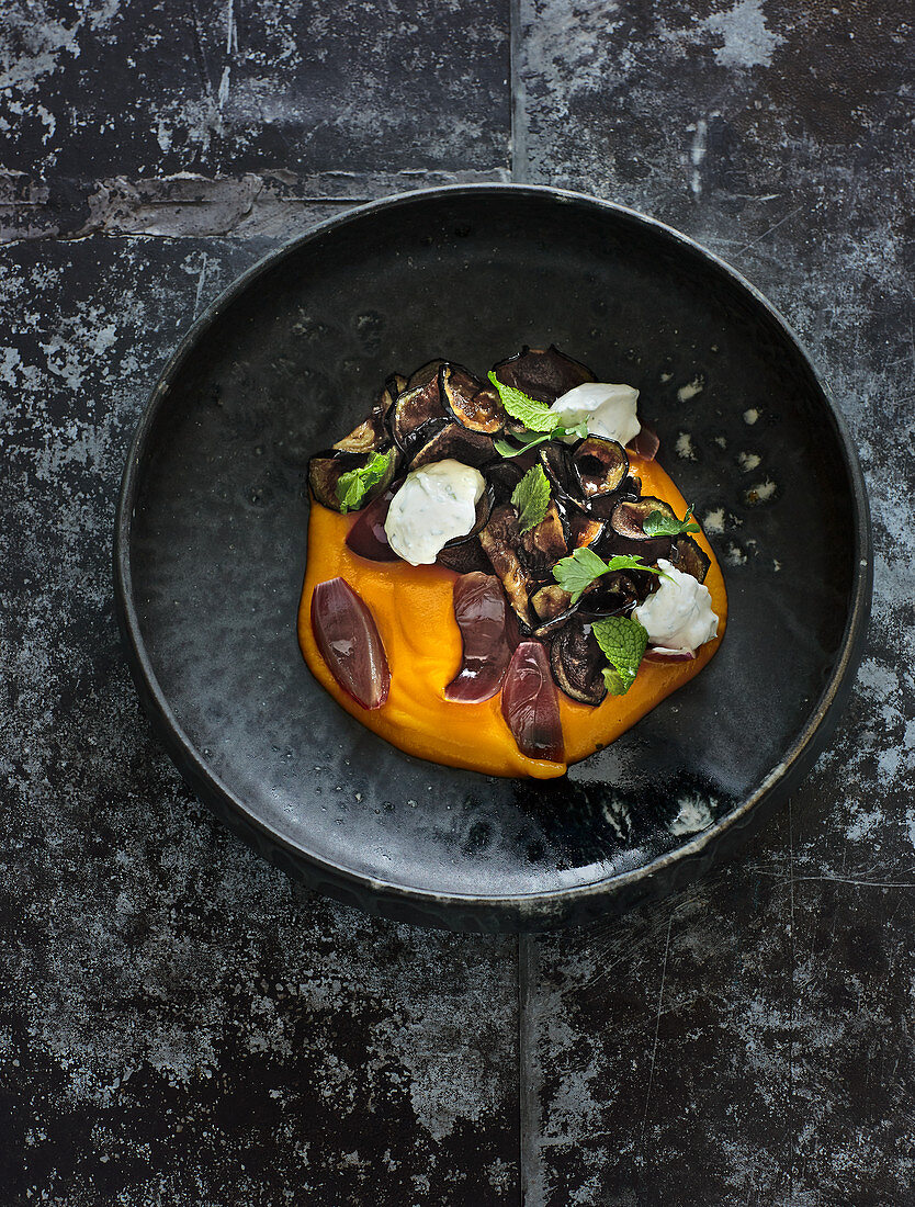 Pumpkin purée with roasted aubergines, herb yoghurt and pickled onions