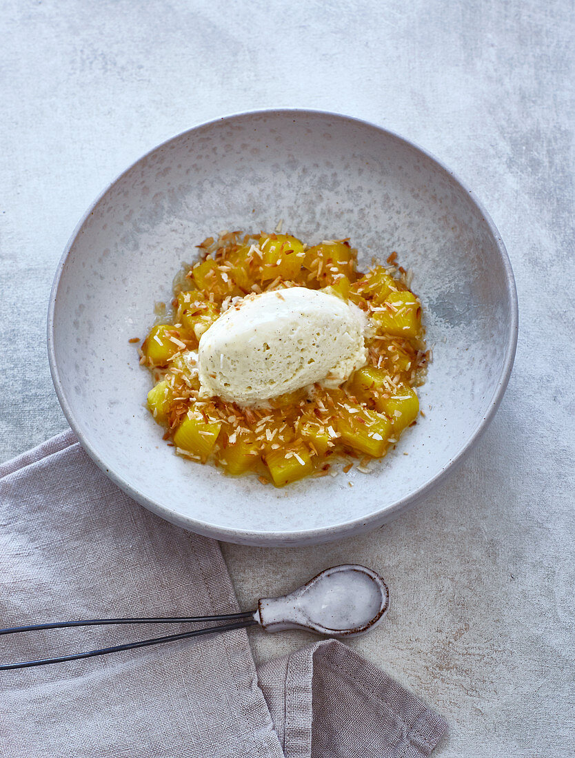 Oven-baked pineapple with coconut and mascarpone cream