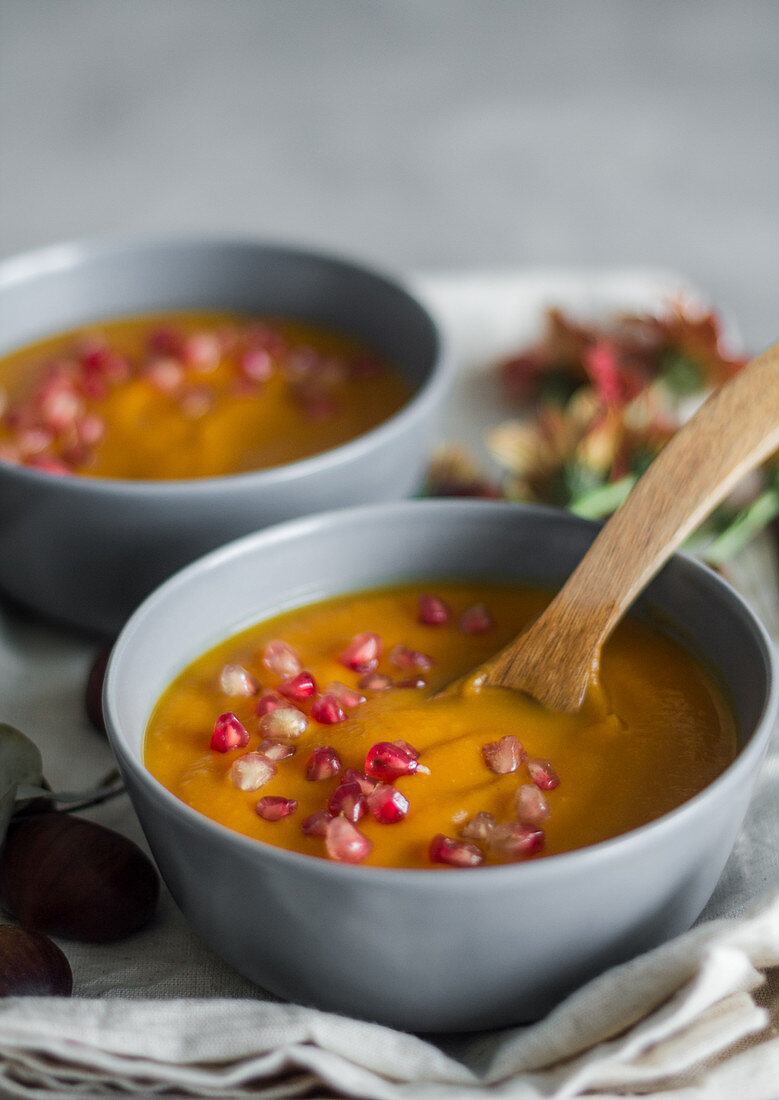 Served bowls of delicious pumpkin soup
