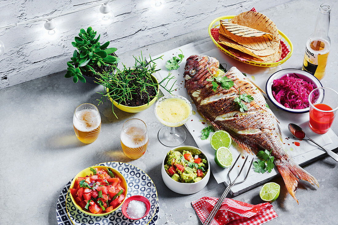 Pez rostizado (roasted whole fish) with pickled red cabbage and pico de gallo