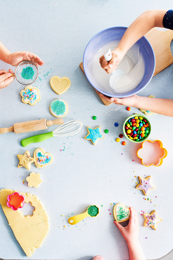 Children decorating biscuits for a children's party