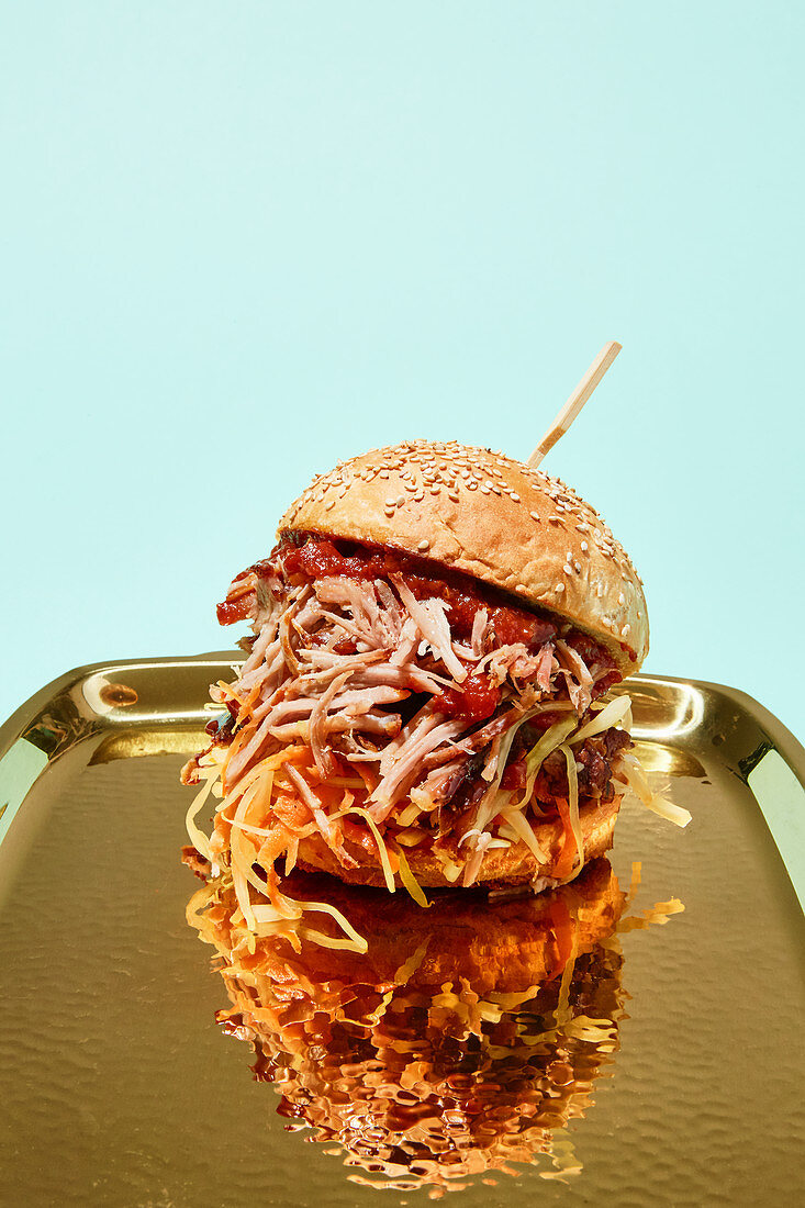 A pulled-pork burger with a beer sauce