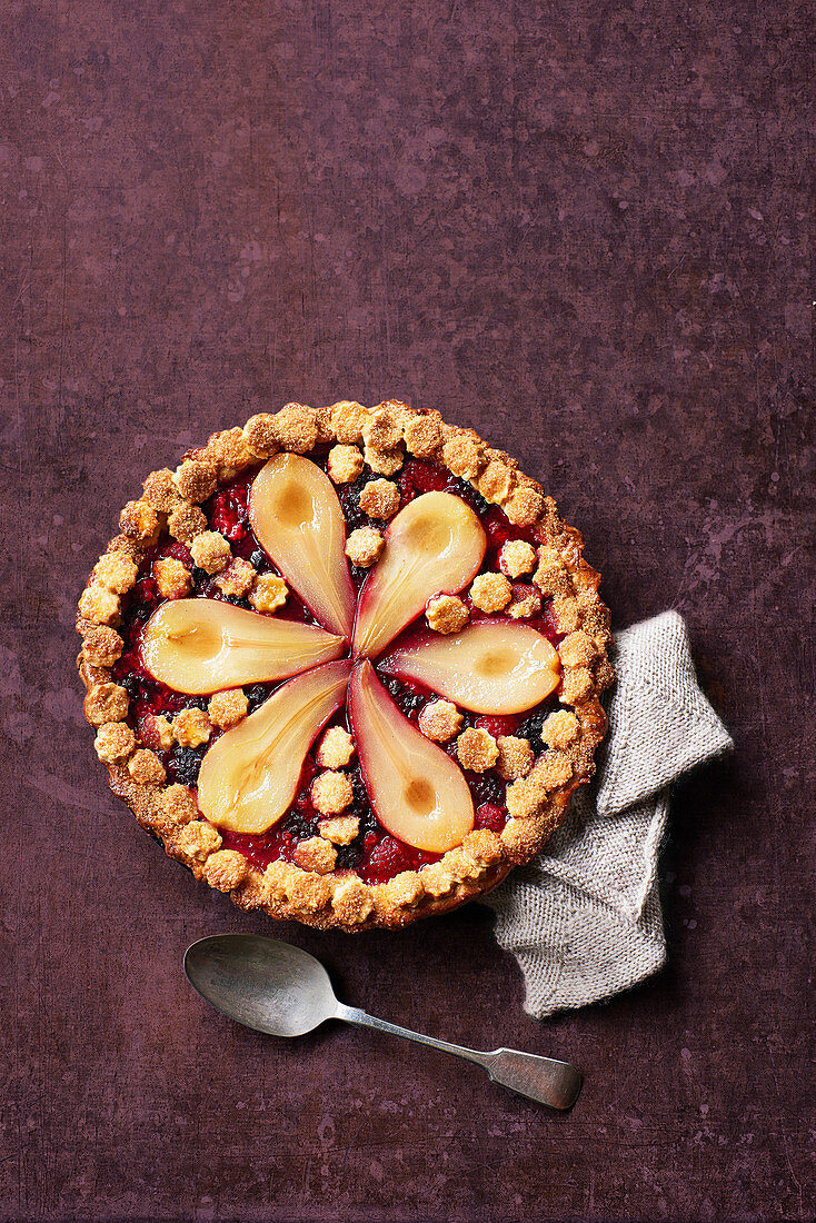Poached pear and berry crumble pie