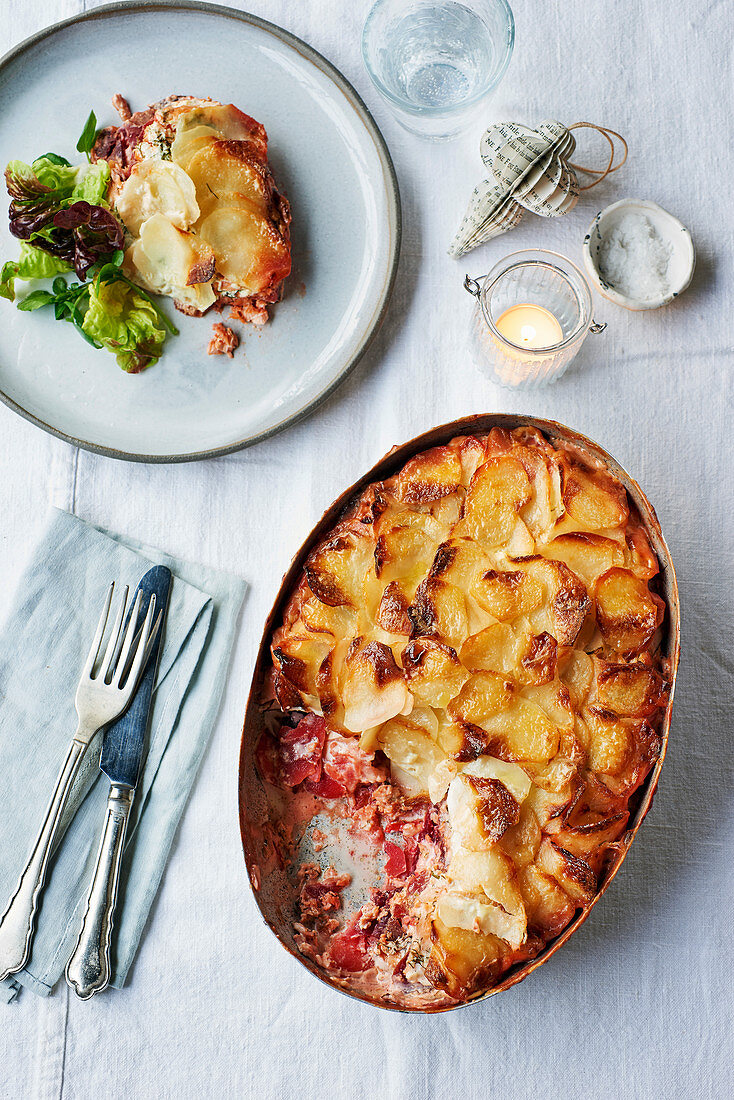 Gratin of fresh and smoked salmon, beetroot, potatoes and dill