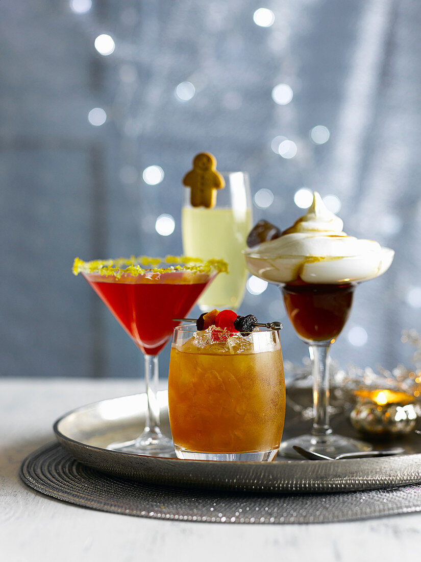 Four cocktails on a silver tray