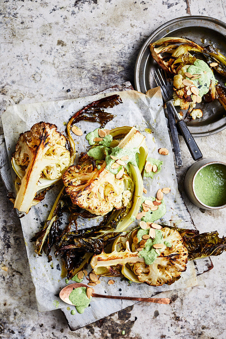 Cauliflower wedges with green tahini and almonds