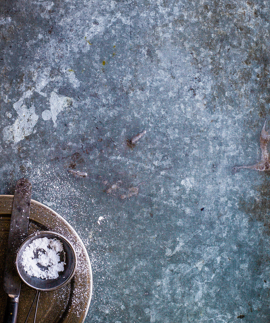 Icing sugar in a sieve