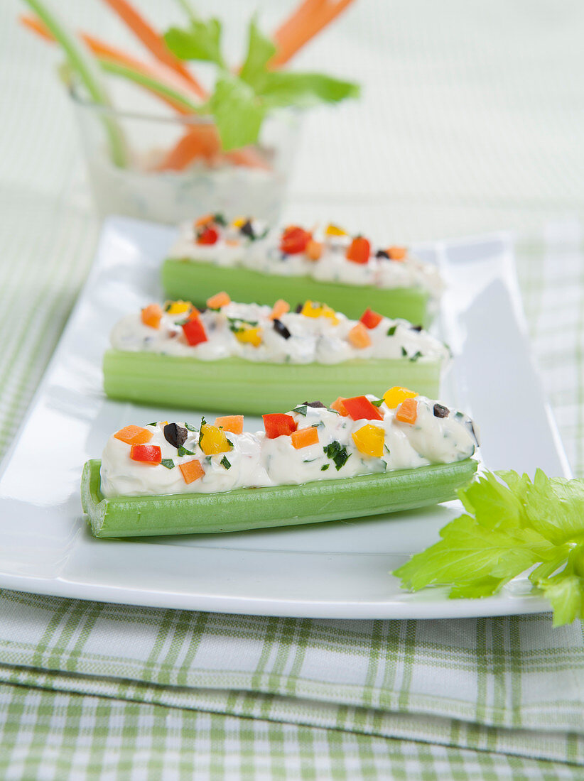 Celery boats with cream cheese and vegetables