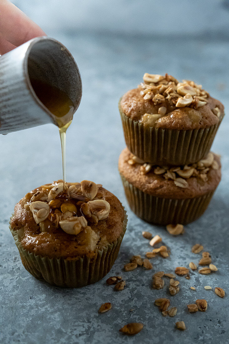 Apple muffins with granola and maple syrup